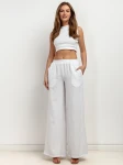 Spodnie wide-leg z miękkiej tkaniny.webp