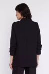 czarny tył eleganckiego żakietu damskiego.webp